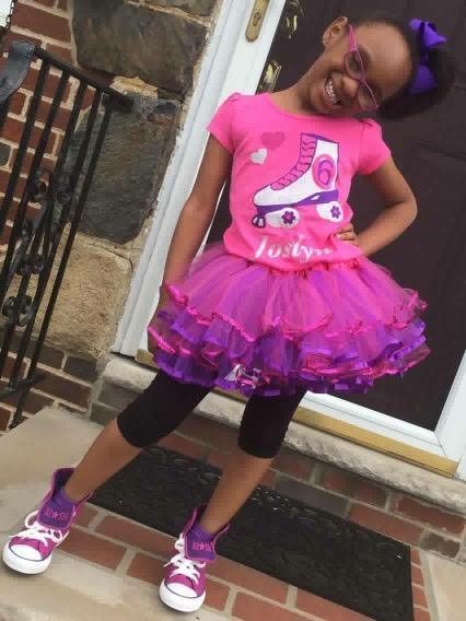 Girl wearing pink roller skate shirt handmade by Bubblegum Divas
