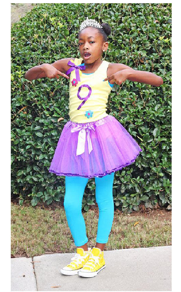 Bubblegum Divas Birthday Girl wearing yellow tank top with number 9 with flowers purple tutu blue leggings and princess crown